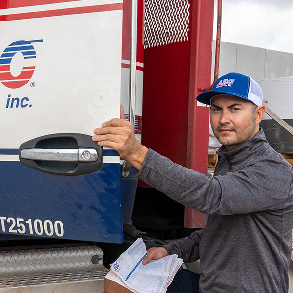 Delivery driver getting into an ABC Supply truck